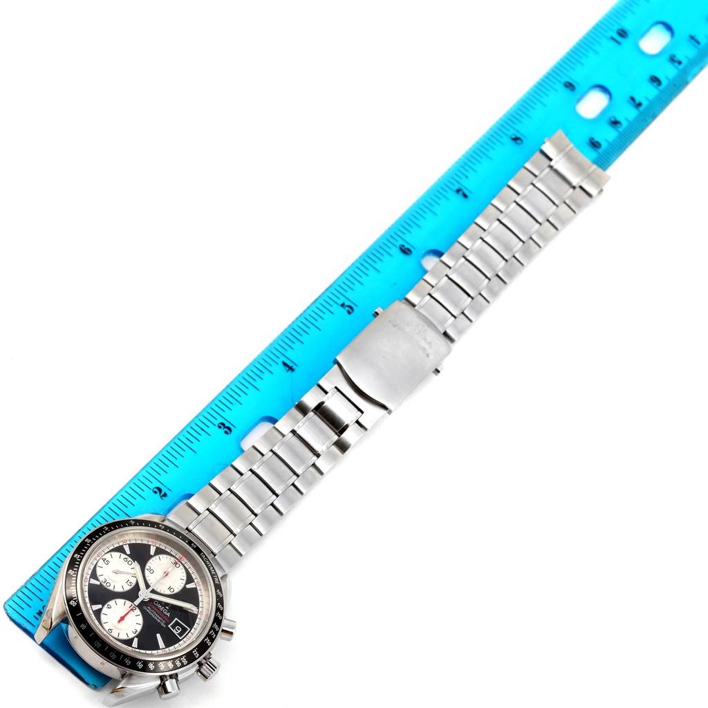 The Omega Speedmaster 3210.51.00 Men
s Stainless Steel Black Dial 3210.51.00 Men
s Stainless Steel Black Dial watch is shown with its full metal bracelet and clasp, alongside a ruler for size reference.