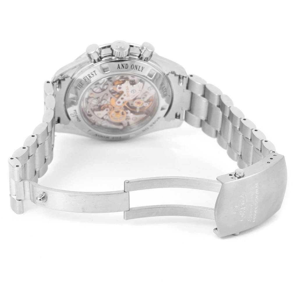 The image shows the back view and inner clasp of an Omega Speedmaster 3573.50.00 Men
s Stainless Steel Black Dial 3573.50.00 Men
s Stainless Steel Black Dial watch, highlighting its bracelet and visible movement.