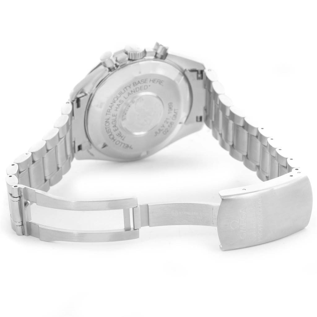 The image shows the backside of the Omega Speedmaster 3560.50.00 Men
s Stainless Steel Black Dial 3560.50.00 Men
s Stainless Steel Black Dial watch and its open metal bracelet clasp.