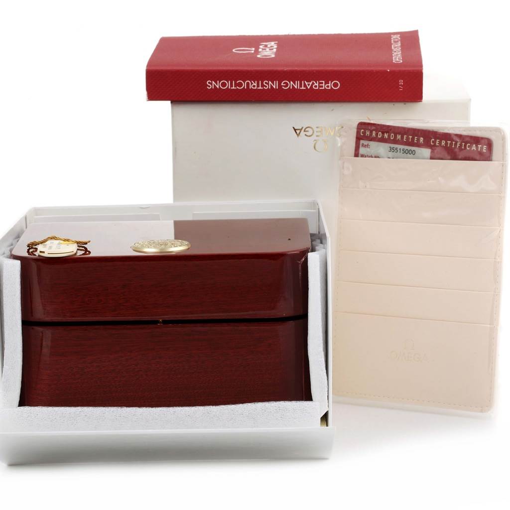 The image shows the packaging, operating instructions, and chronometer certificate for the Omega Speedmaster 3551.50.00 Men
s Stainless Steel Black Dial 3551.50.00 Men
s Stainless Steel Black Dial watch.