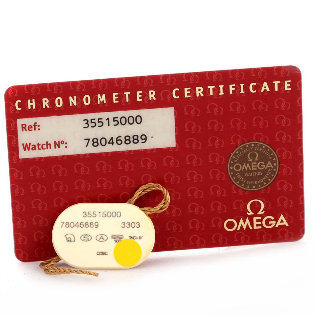 The image shows an Omega Speedmaster 3551.50.00 Men
s Stainless Steel Black Dial 3551.50.00 Men
s Stainless Steel Black Dial
s chronometer certificate card and a tag with reference and watch numbers.