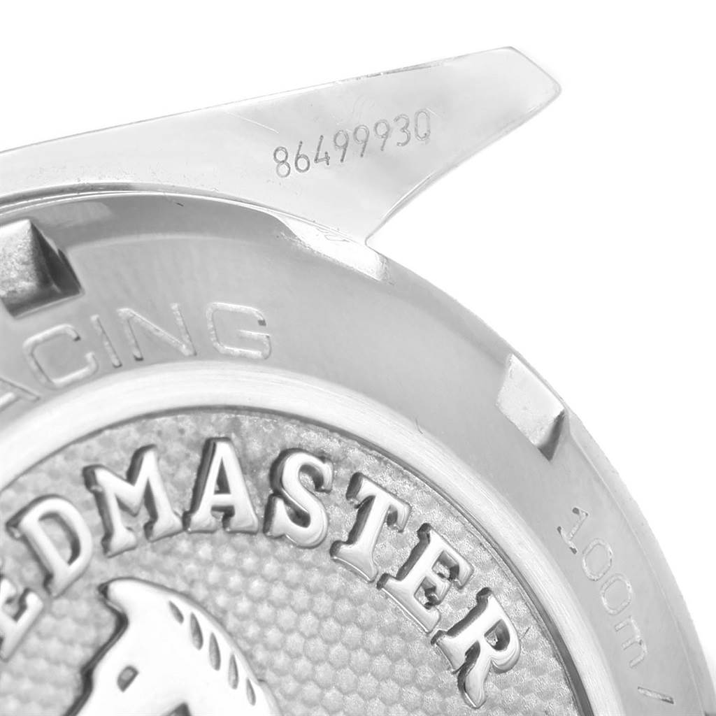 This close-up image shows the case back of the Omega Speedmaster 326.30.40.50.02.001 Men
s Stainless Steel White Dial 326.30.40.50.02.001 Men
s Stainless Steel White Dial watch, highlighting the engraved model name, partial design, and serial number.