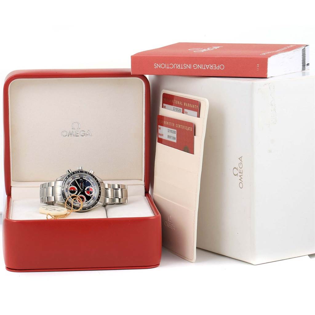 The Omega Speedmaster 3210.52.00 Men
s Stainless Steel Black Dial 3210.52.00 Men
s Stainless Steel Black Dial watch is shown in its box along with the warranty cards and operating instructions.