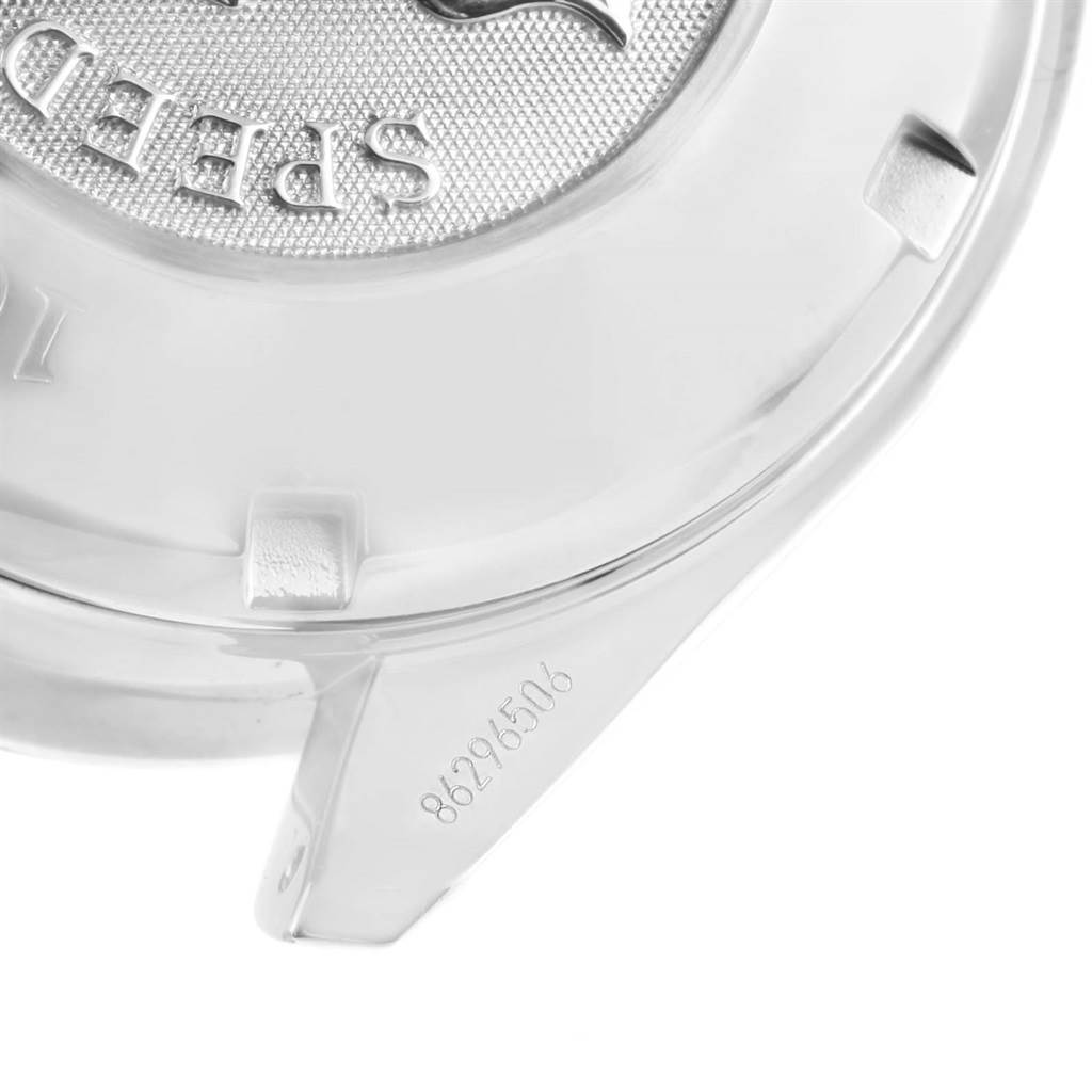 The image shows a close-up angle of the case back and part of the casing of the Omega Speedmaster 3220.50.00 Men
s Stainless Steel Black Dial 3220.50.00 Men
s Stainless Steel Black Dial watch, including the serial number.