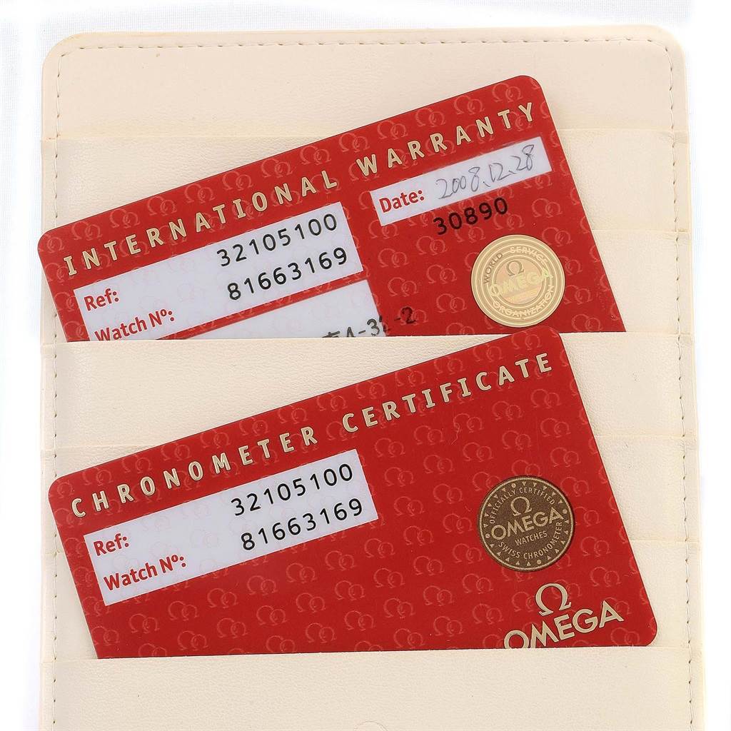 The image shows the international warranty and chronometer certificate cards for an Omega Speedmaster 3210.51.00 Men
s Stainless Steel Black Dial 3210.51.00 Men
s Stainless Steel Black Dial watch.