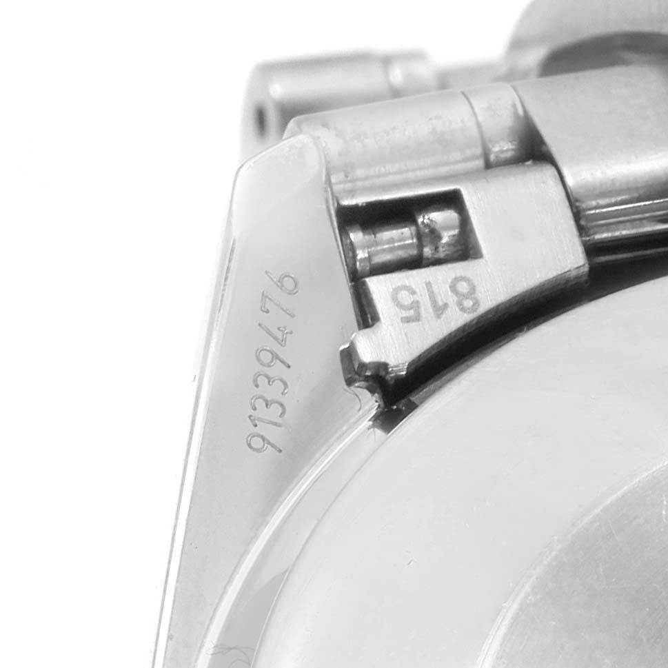 The image shows a close-up of the lug and end link of the Omega Speedmaster 3539.50.00 Men
s Stainless Steel Black Dial 3539.50.00 Men
s Stainless Steel Black Dial watch, including the serial number engraving.