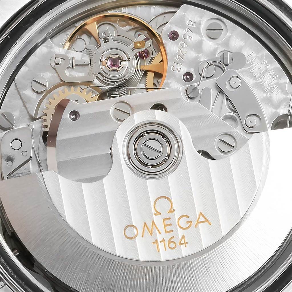 The close-up image shows the movement and internal mechanisms of the Omega Speedmaster 3210.50.00 Men
s Stainless Steel Black Dial 3210.50.00 Men
s Stainless Steel Black Dial watch.