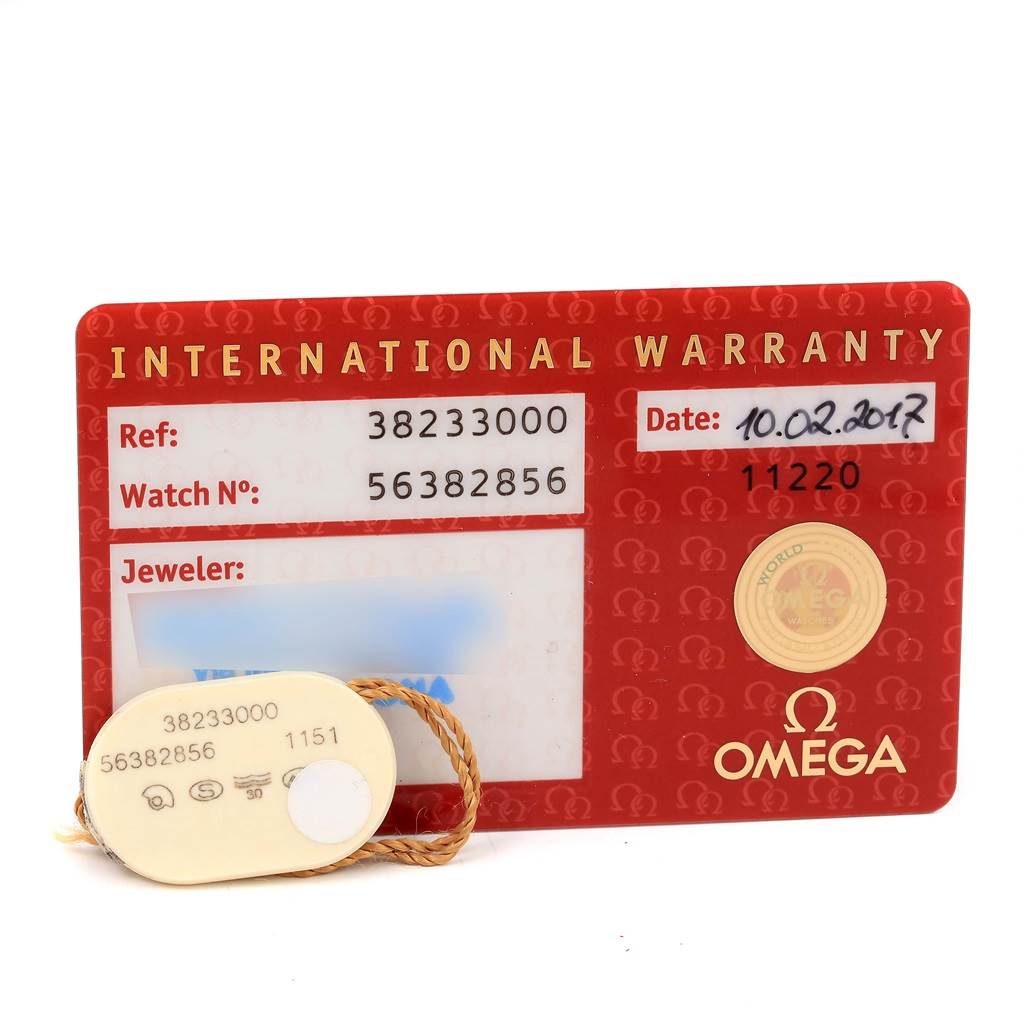 The image shows the International Warranty card and tag for the Omega Speedmaster 3823.30.00 Men
s Stainless Steel Silver Dial 3823.30.00 Men
s Stainless Steel Silver Dial watch model.