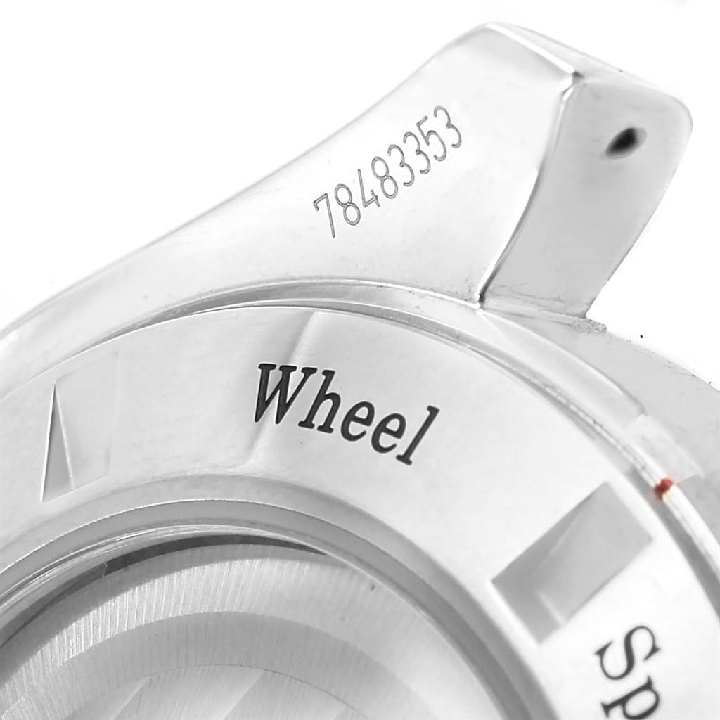 This image shows a close-up of the serial number and partial labeling on the bezel of an Omega Speedmaster 311.30.44.50.01.002 Men's Stainless Steel Black Dial 311.30.44.50.01.002 Men's Stainless Steel Black Dial watch.