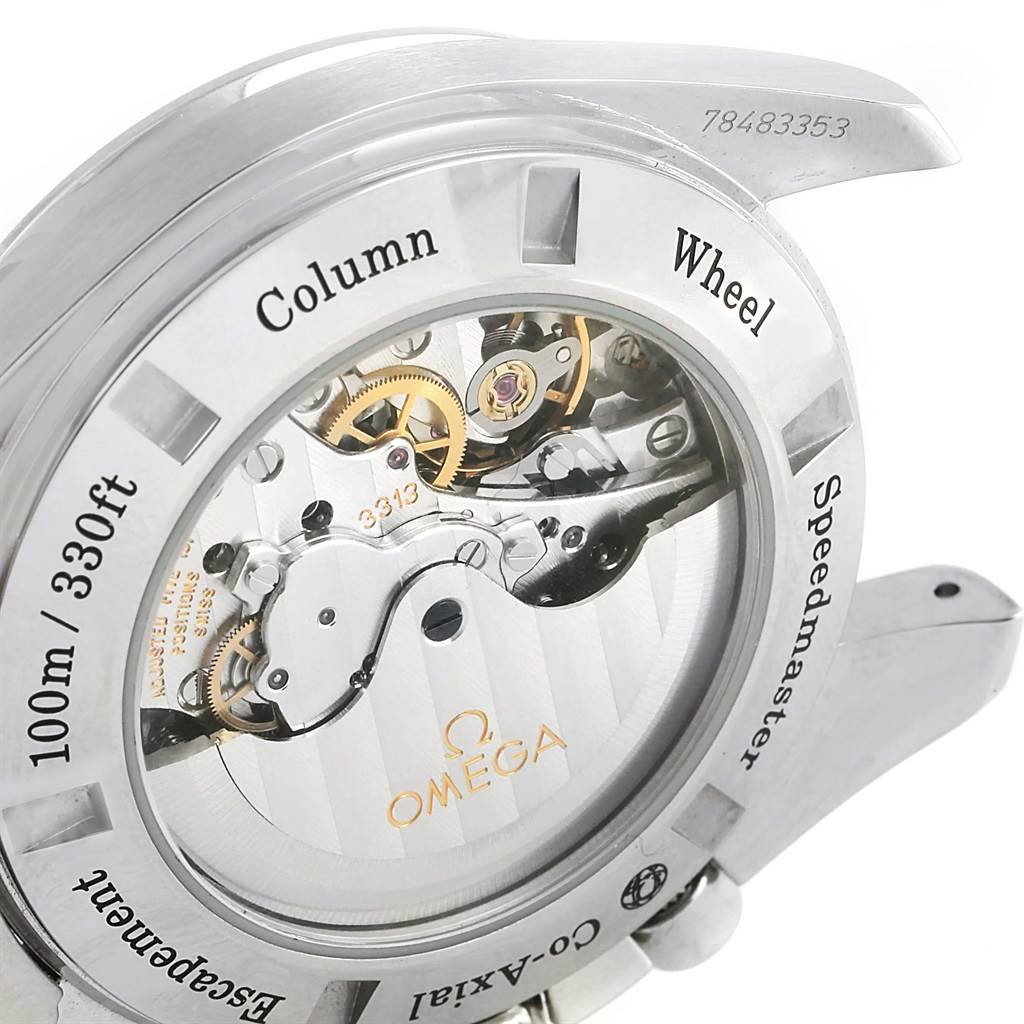 The image shows the back view of an Omega Speedmaster 311.30.44.50.01.002 Men's Stainless Steel Black Dial 311.30.44.50.01.002 Men's Stainless Steel Black Dial watch, highlighting its inner mechanical components and inscriptions.