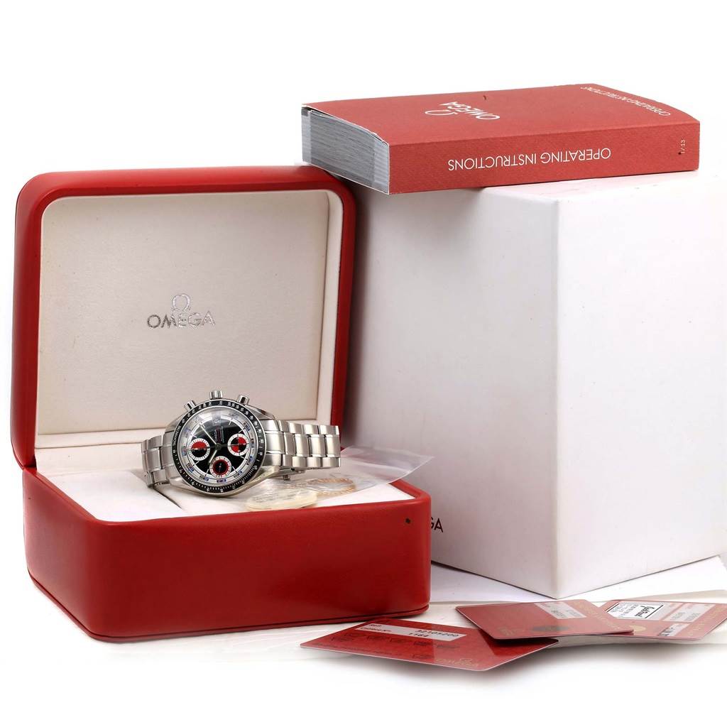 The Omega Speedmaster 3210.52.00 Men
s Stainless Steel Black Dial 3210.52.00 Men
s Stainless Steel Black Dial watch is shown inside its red case with its operating instructions and Best Quality
ation cards.