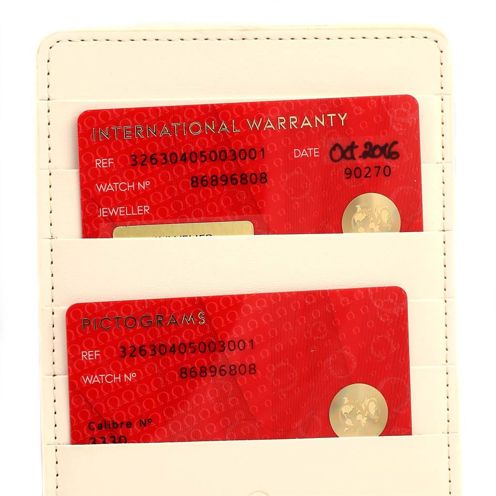 This image shows the International Warranty and Pictograms cards for the Omega Speedmaster 326.30.40.50.03.001 Men's Stainless Steel Blue Dial 326.30.40.50.03.001 Men's Stainless Steel Blue Dial watch, displayed in a cardholder.