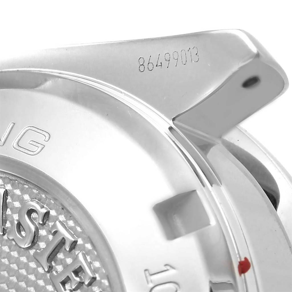 This close-up image shows the back case and a partial view of the bracelet lug of an Omega Speedmaster 326.30.40.50.01.001 Men
s Stainless Steel Black Dial 326.30.40.50.01.001 Men
s Stainless Steel Black Dial watch with a visible serial number.