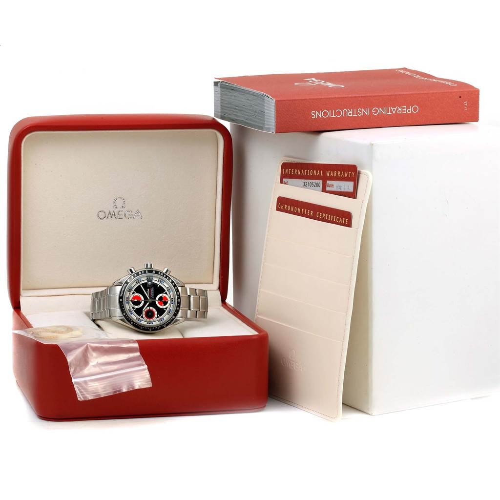 The Omega Speedmaster 3210.52.00 Men
s Stainless Steel Black Dial 3210.52.00 Men
s Stainless Steel Black Dial watch is displayed in its box with an operating manual and warranty card visible.