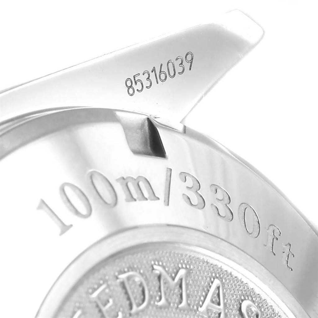 This image shows the case back of an Omega Speedmaster 3211.31.00 Men
s Stainless Steel Silver Dial 3211.31.00 Men
s Stainless Steel Silver Dial watch, highlighting water resistance specifications and part of the serial number.