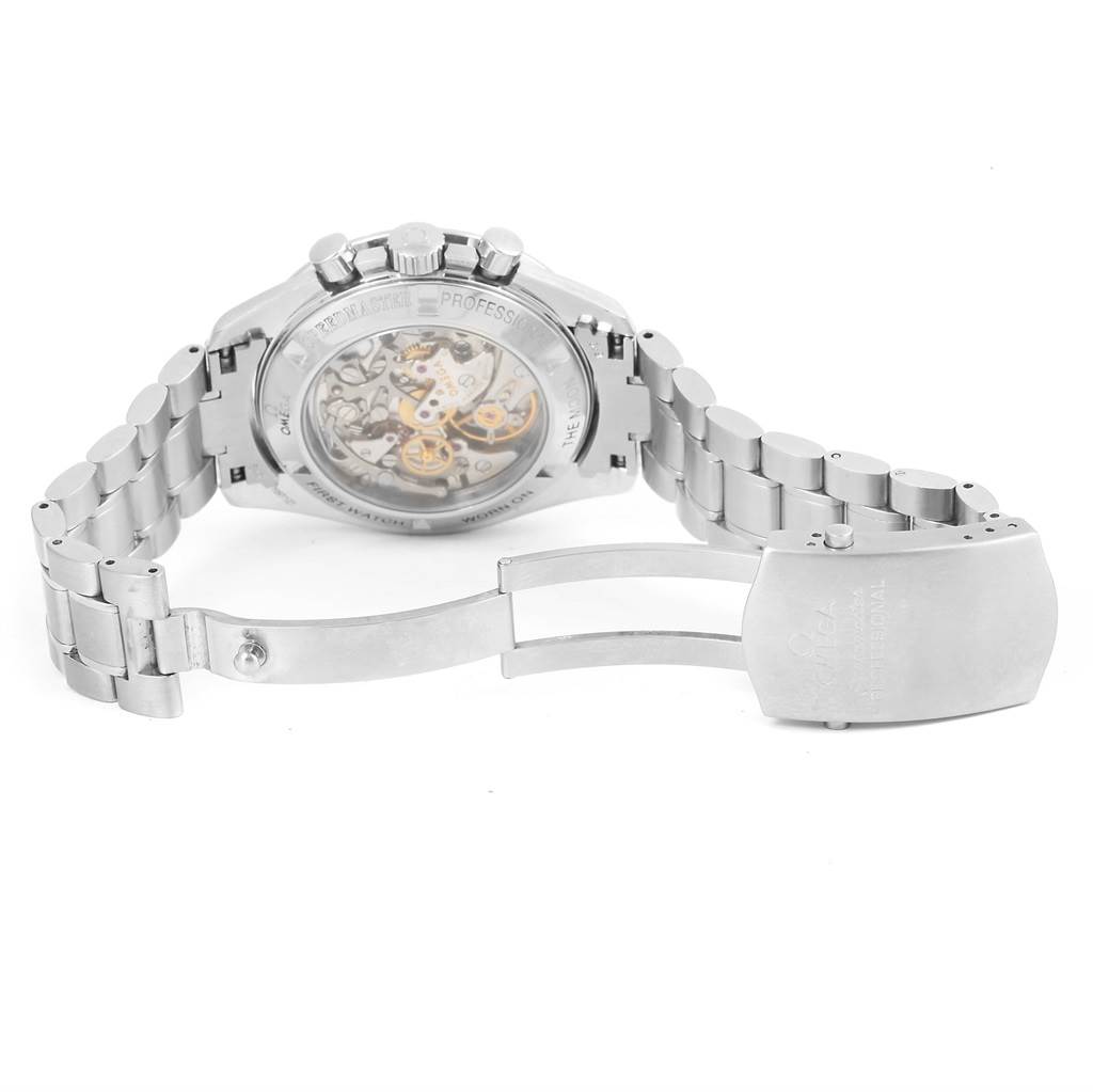 The image shows the back view of the Omega Speedmaster 3572.50.00 Men
s Stainless Steel Black Dial 3572.50.00 Men
s Stainless Steel Black Dial watch, highlighting its movement and stainless steel bracelet with the clasp open.