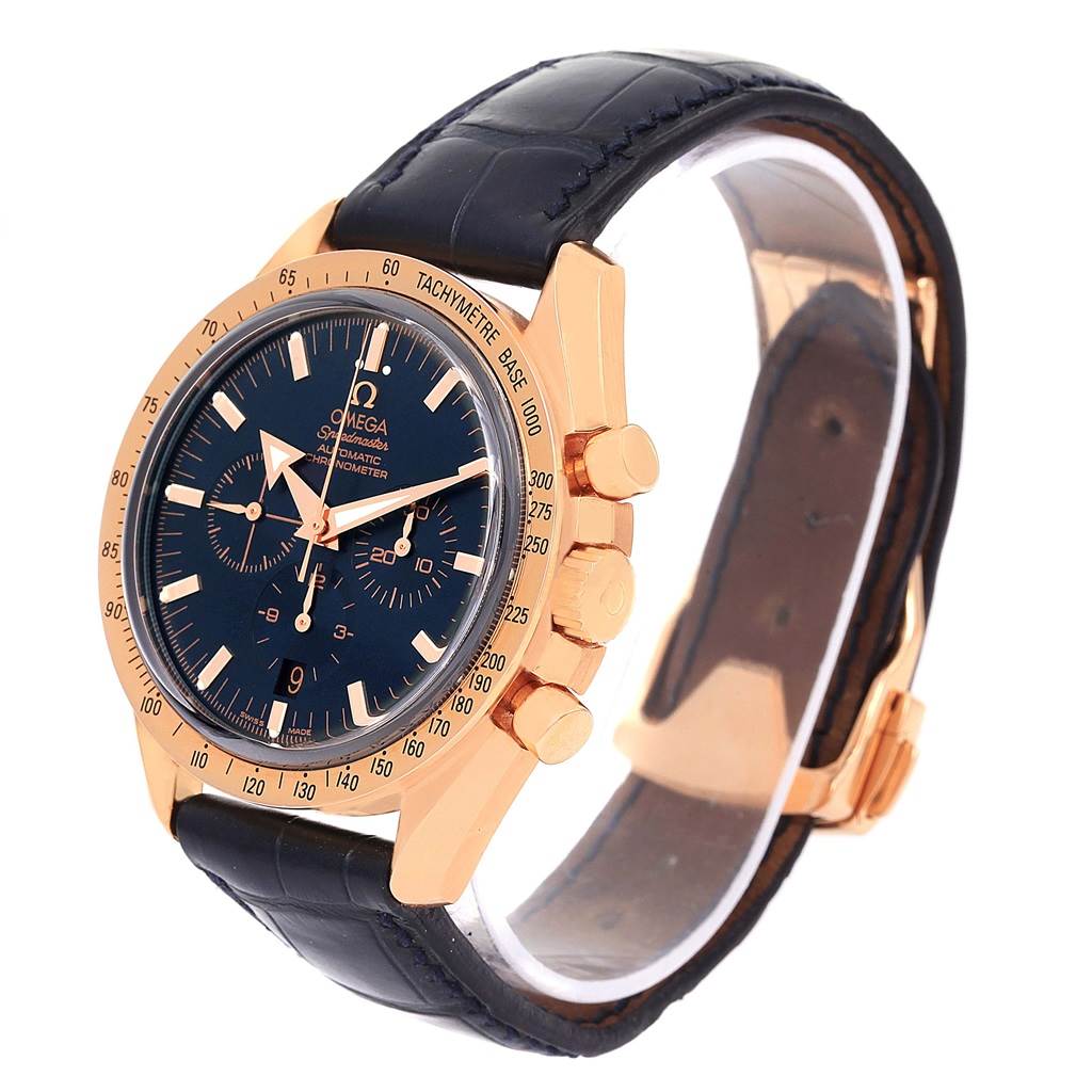 The image shows an angled side view of the Omega Speedmaster 178.0022 Men's Blue Dial 178.0022 Men's Blue Dial watch, highlighting its black strap, gold case, chronograph buttons, and tachymeter bezel.