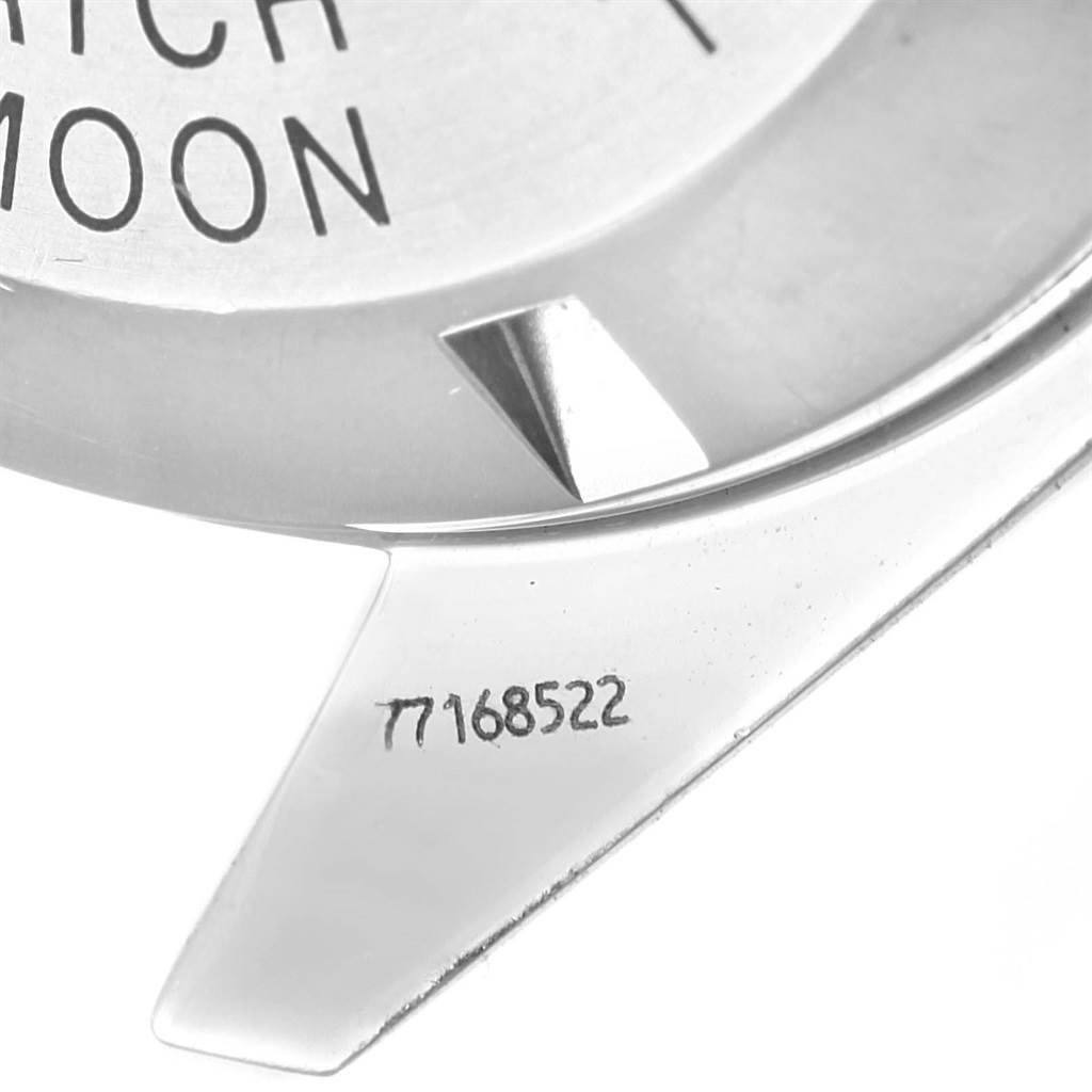 The image shows a close-up of the Omega Speedmaster 3570.50.00 Men
s Stainless Steel Black Dial 3570.50.00 Men
s Stainless Steel Black Dial watch case back, featuring part of its engraved serial number.