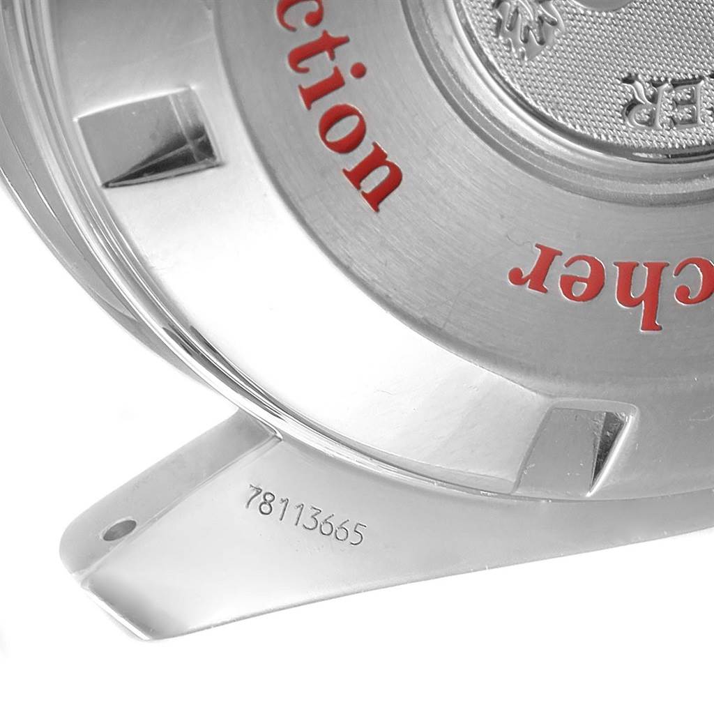 The image shows the back of the Omega Speedmaster 3506.61.00 Men's Stainless Steel Red Dial 3506.61.00 Men's Stainless Steel Red Dial watch, including part of the case back and a portion of the serial number.