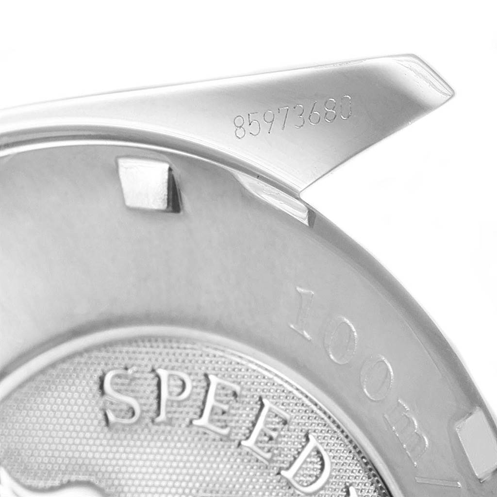 The image shows a close-up angle of the case back of an Omega Speedmaster 3210.52.00 Men
s Stainless Steel Black Dial 3210.52.00 Men
s Stainless Steel Black Dial watch.