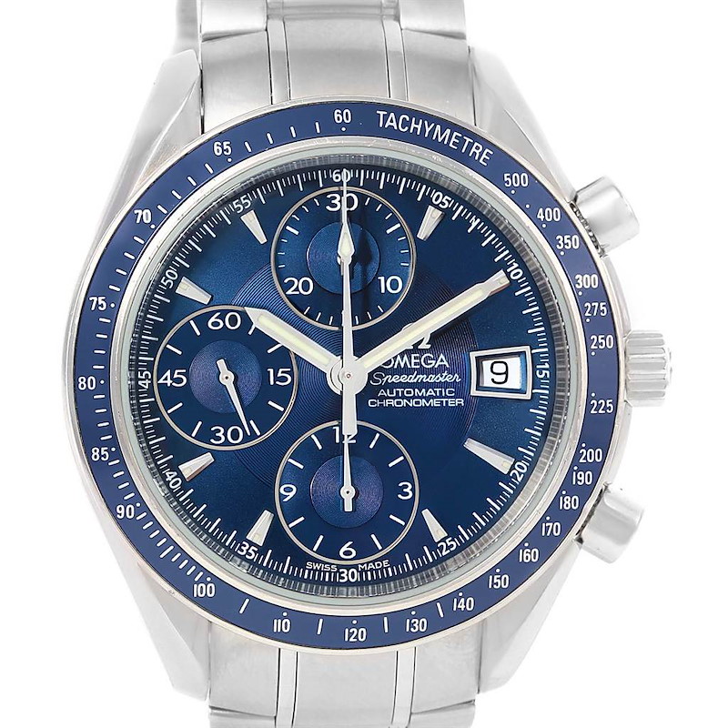 The image shows a front view of the Omega Speedmaster watch, featuring a blue dial, chronograph sub-dials, and a tachymeter bezel.