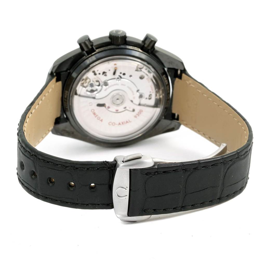 The image shows the back view of an Omega Speedmaster 311.92.44.51.01.003 Men's Stainless Steel Black Dial 311.92.44.51.01.003 Men's Stainless Steel Black Dial watch, highlighting its movement and leather strap with clasp.