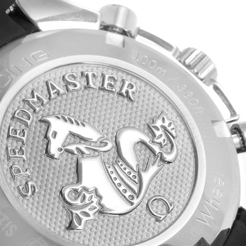 The image shows the case back of an Omega Speedmaster 326.32.40.50.03.001 Men
s Stainless Steel Blue Dial 326.32.40.50.03.001 Men
s Stainless Steel Blue Dial watch, highlighting its emblem and engravings.