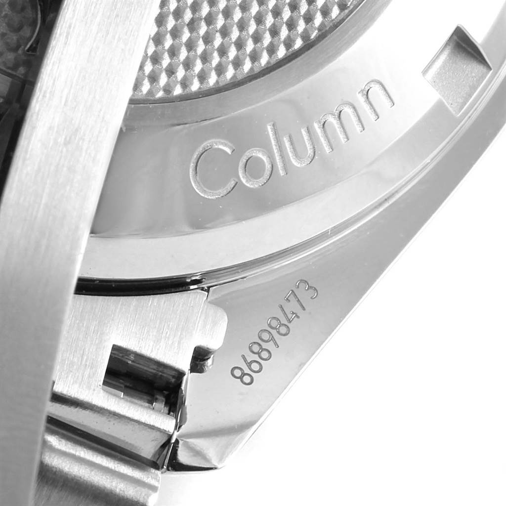 This close-up image of the Omega Speedmaster 326.30.40.50.01.001 Men
s Stainless Steel Black Dial 326.30.40.50.01.001 Men
s Stainless Steel Black Dial watch shows part of the case and bracelet, featuring the word "Column" and some serial numbers.