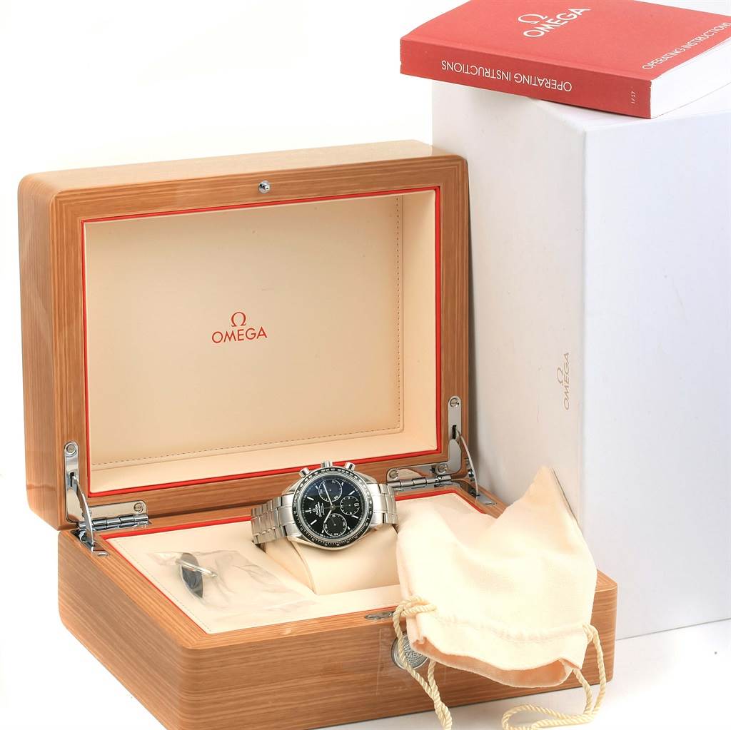 The Omega Speedmaster 326.30.40.50.01.001 Men
s Stainless Steel Black Dial 326.30.40.50.01.001 Men
s Stainless Steel Black Dial watch is displayed in an open wooden box with a storage pouch and operating instructions visible.