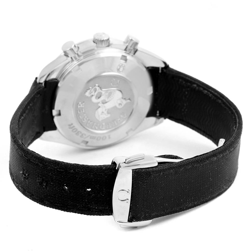 The image shows the back case, crown, and pushers of an Omega Speedmaster 323.32.40.40.04.001 Men
s Stainless Steel White Dial 323.32.40.40.04.001 Men
s Stainless Steel White Dial watch, along with its black strap and buckle.