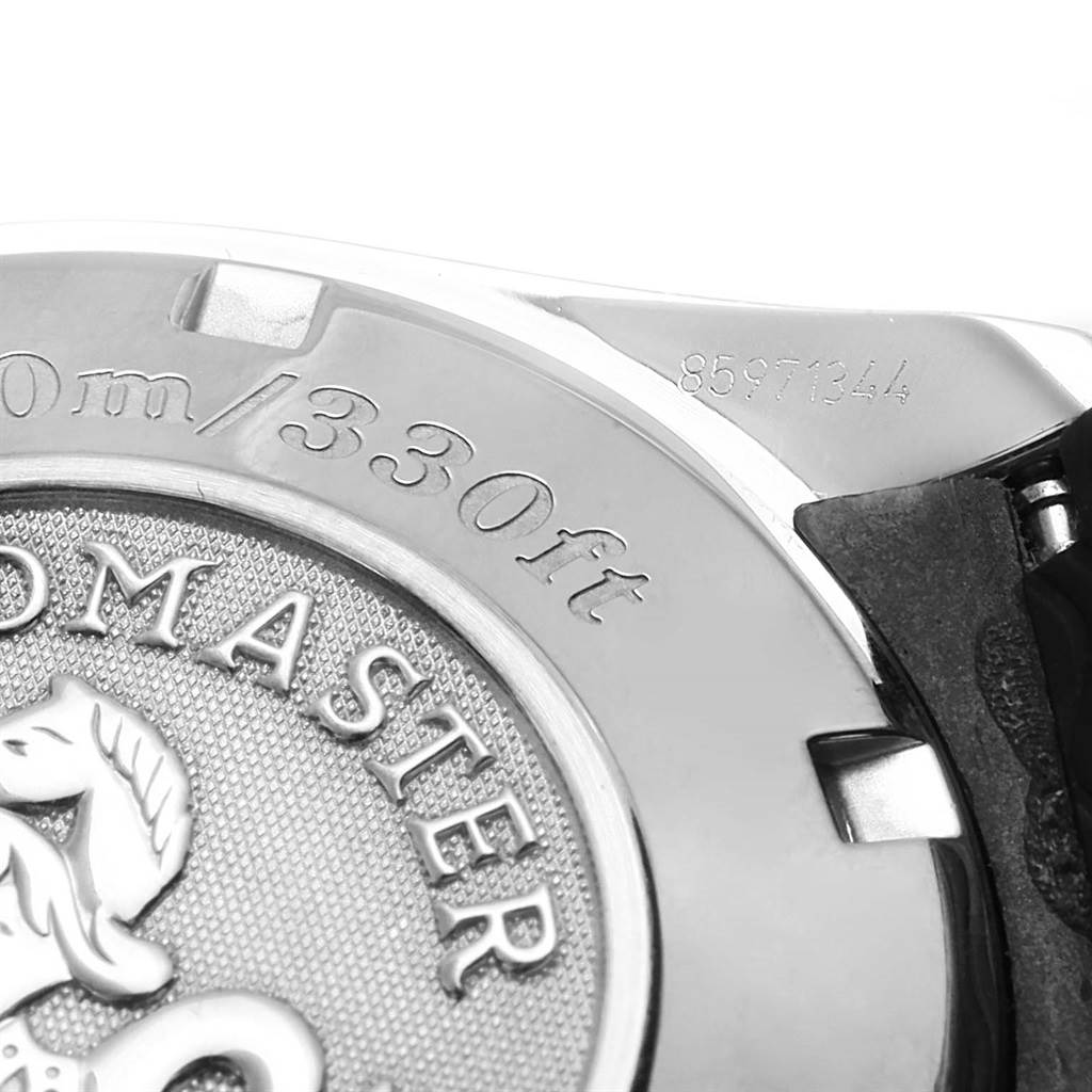 The image shows a close-up of the back of an Omega Speedmaster 323.32.40.40.04.001 Men
s Stainless Steel White Dial 323.32.40.40.04.001 Men
s Stainless Steel White Dial watch, highlighting its water resistance rating and serial number.