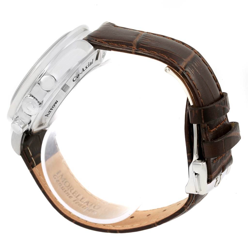 Side view of an Omega Speedmaster 3881.30.37 Men
s Stainless Steel Silver Dial 3881.30.37 Men
s Stainless Steel Silver Dial, showing its case, crown, pushers, and brown leather strap with a buckle clasp.