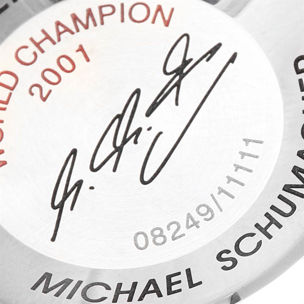 The image shows the case back of an Omega Speedmaster 3519.50.00 Men
s Stainless Steel Black Dial 3519.50.00 Men
s Stainless Steel Black Dial watch, featuring an engraving that includes "WORLD CHAMPION 2001," a signature, and "MICHAEL SCHUMACHER."