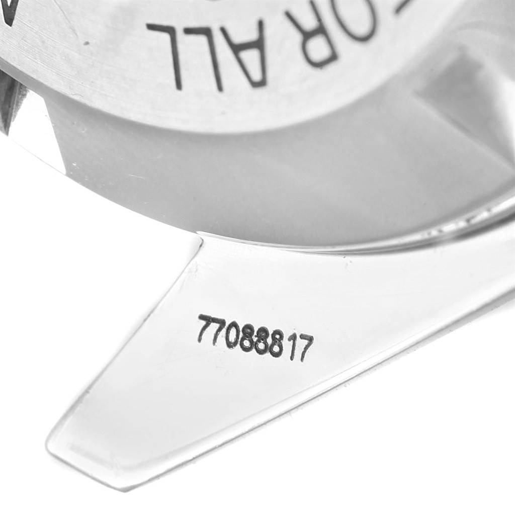 The image shows the serial number and partial engraving on the back of an Omega Speedmaster 3570.50.00 Men
s Stainless Steel Black Dial 3570.50.00 Men
s Stainless Steel Black Dial watch.