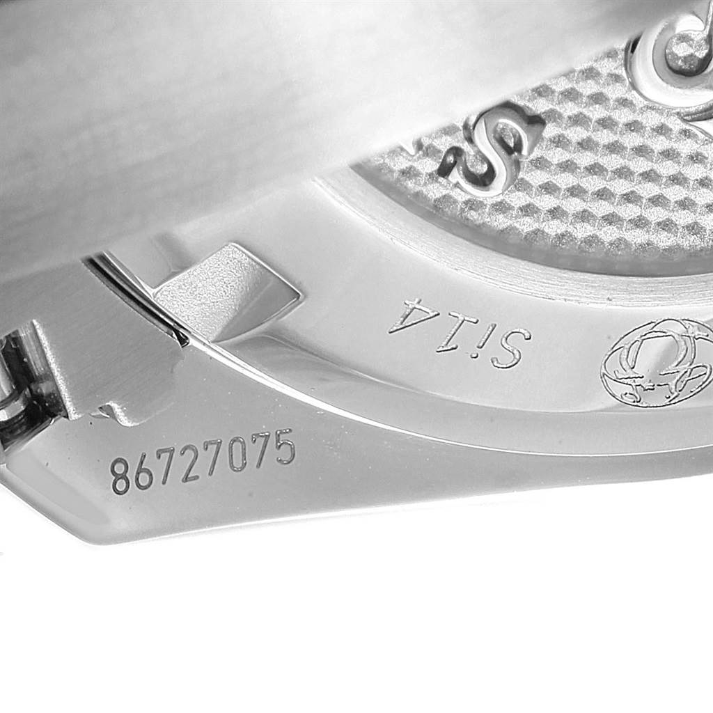 This close-up image shows the back case and part of the clasp of an Omega Speedmaster 326.30.40.50.01.001 Men
s Stainless Steel Black Dial 326.30.40.50.01.001 Men
s Stainless Steel Black Dial watch, featuring serial numbers and inscriptions.