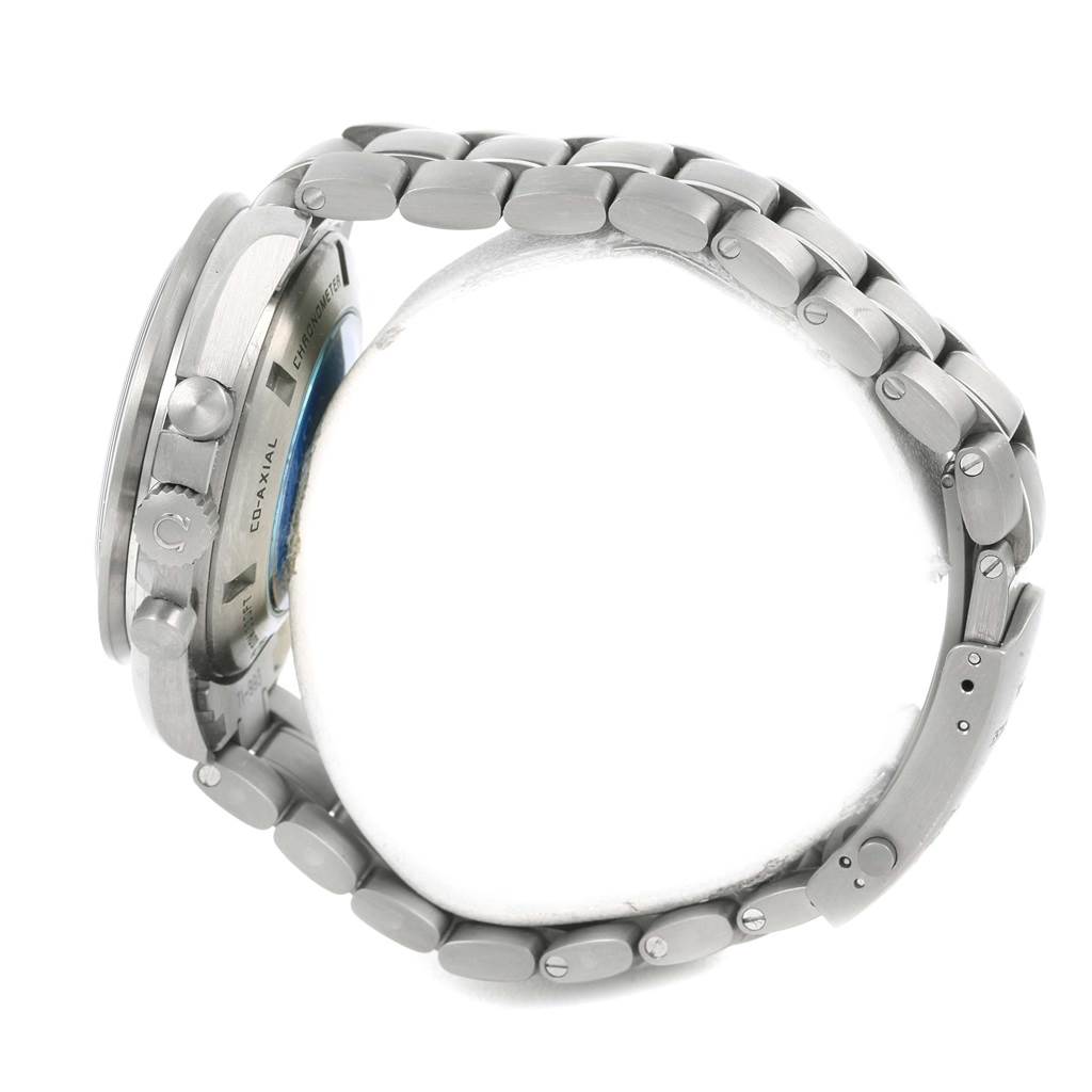 The image shows a side view of the Omega Speedmaster 321.90.44.52.01.001 Men's Titanium Black Dial 321.90.44.52.01.001 Men's Titanium Black Dial watch, highlighting its case, crown, and bracelet.