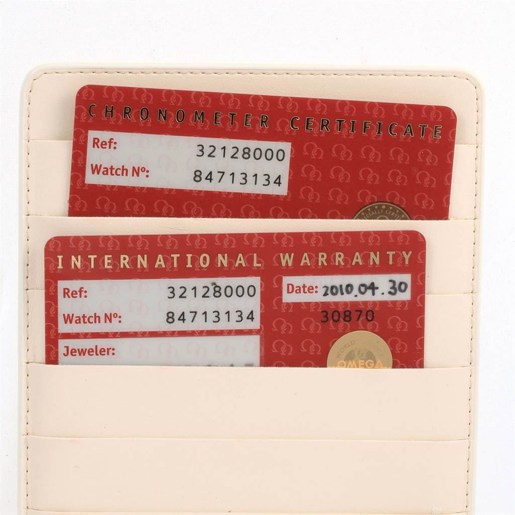 The image shows the Chronometer Certificate and International Warranty cards for an Omega Speedmaster 3212.80.00 Men
s Stainless Steel Blue Dial 3212.80.00 Men
s Stainless Steel Blue Dial watch.