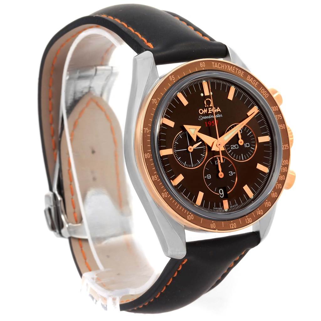 The Omega Speedmaster 321.93.42.50.13.001 Men
s Steel and Gold (two tone) Brown Dial 321.93.42.50.13.001 Men
s Steel and Gold (two tone) Brown Dial watch is shown at a three-quarter angle, highlighting its black dial, orange accents, and black leather strap.
