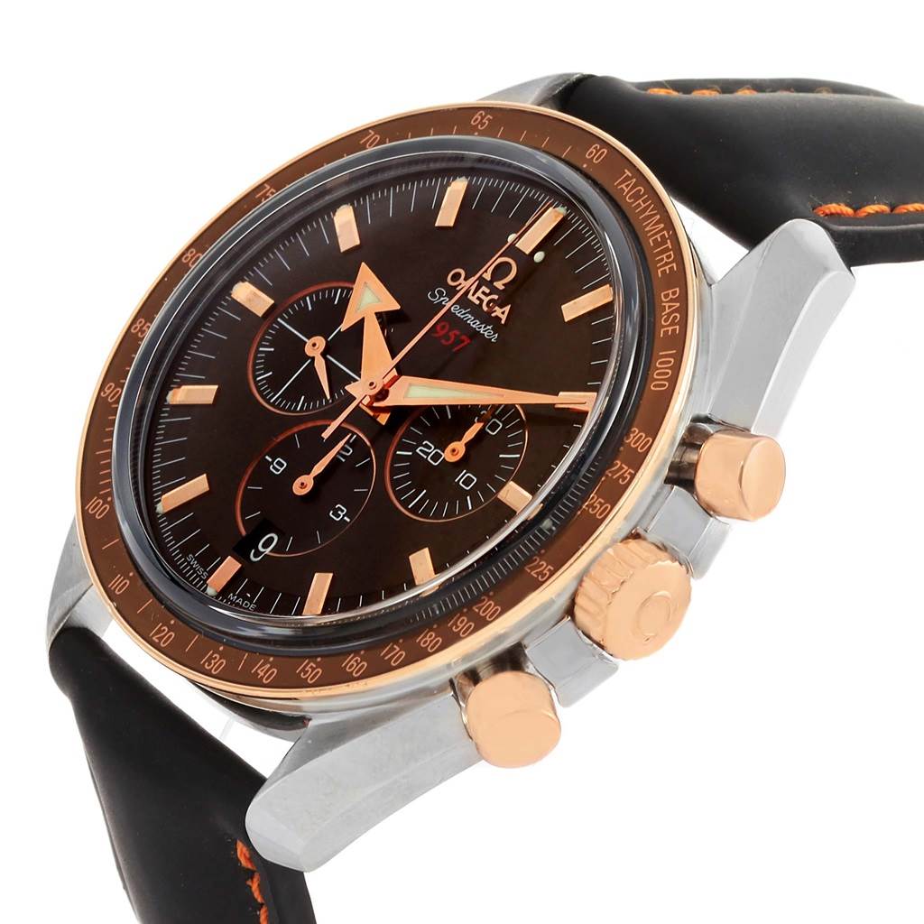 This Omega Speedmaster 321.93.42.50.13.001 Men
s Steel and Gold (two tone) Brown Dial 321.93.42.50.13.001 Men
s Steel and Gold (two tone) Brown Dial watch is shown at an angle displaying the face, bezel, crown, pushers, and part of the strap.