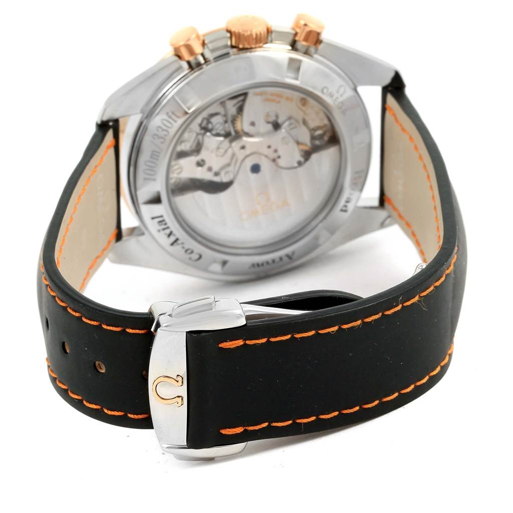 This image shows the back view of an Omega Speedmaster 321.93.42.50.13.001 Men
s Steel and Gold (two tone) Brown Dial 321.93.42.50.13.001 Men
s Steel and Gold (two tone) Brown Dial watch, highlighting the movement and black leather strap with orange stitching.
