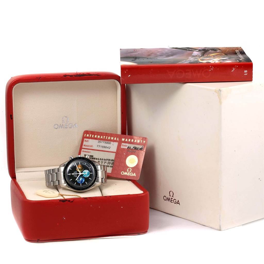 The Omega Speedmaster 3577.50.00 Men's Stainless Steel Black Dial 3577.50.00 Men's Stainless Steel Black Dial watch is displayed in its case with warranty cards and packaging visible.