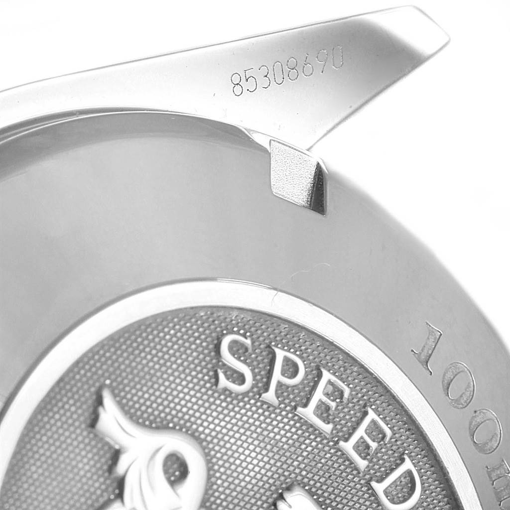 The image shows a close-up of the back case of an Omega Speedmaster 323.30.40.40.04.001 Men
s Stainless Steel White Dial 323.30.40.40.04.001 Men
s Stainless Steel White Dial watch, featuring the serial number and part of the logo.