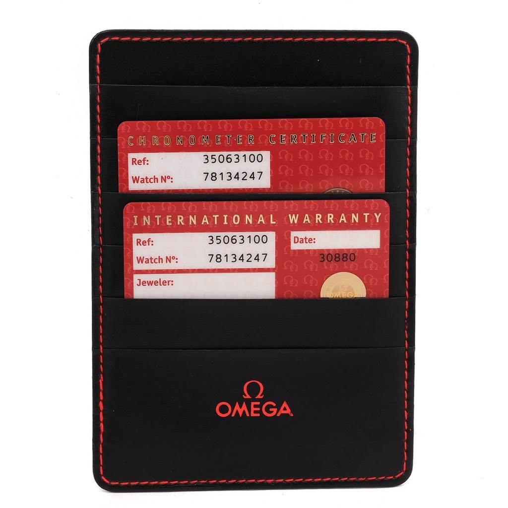 The image shows an Omega Speedmaster 3506.31.00 Men's Stainless Steel Silver Dial 3506.31.00 Men's Stainless Steel Silver Dial warranty card holder with chronometer certificate and international warranty cards.