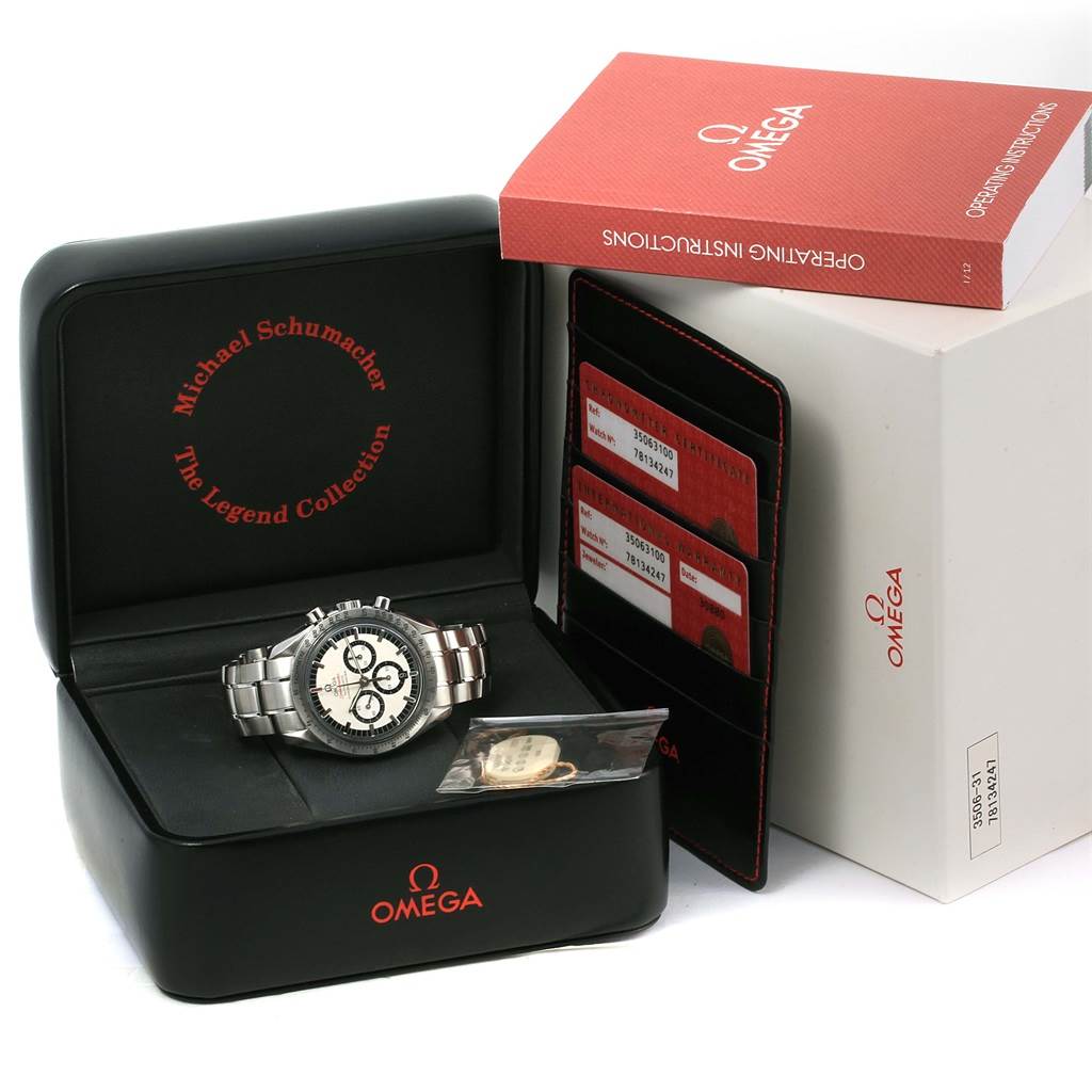 The image shows an Omega Speedmaster 3506.31.00 Men's Stainless Steel Silver Dial 3506.31.00 Men's Stainless Steel Silver Dial watch in its open box, alongside an operating instructions booklet and warranty cards.