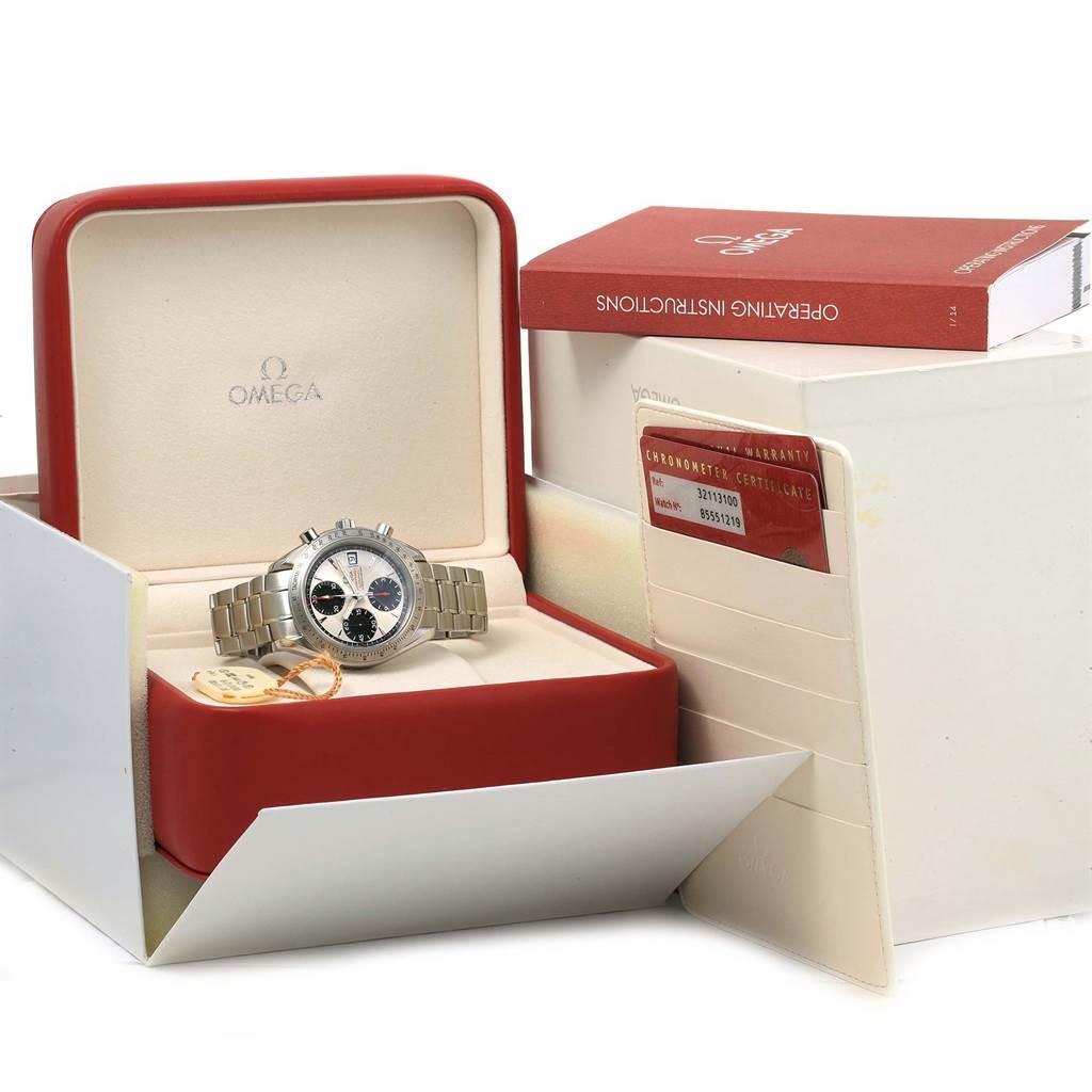 The Omega Speedmaster 3211.31.00 Men
s Stainless Steel Silver Dial 3211.31.00 Men
s Stainless Steel Silver Dial watch is displayed in its open box, accompanied by its operating instructions and warranty card.