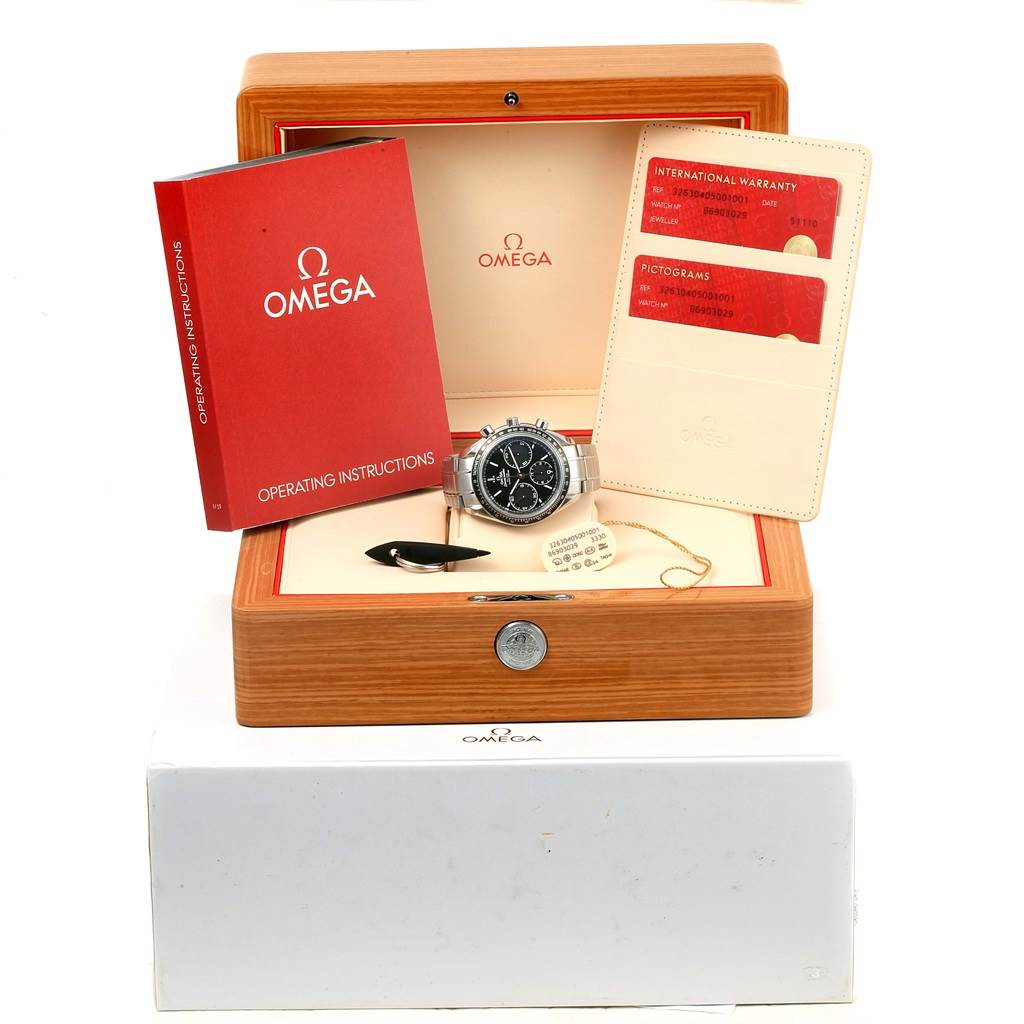 The image displays an Omega Speedmaster 326.30.40.50.01.001 Men
s Stainless Steel Black Dial 326.30.40.50.01.001 Men
s Stainless Steel Black Dial watch, its wooden box, manuals, warranty card, and additional accessories.