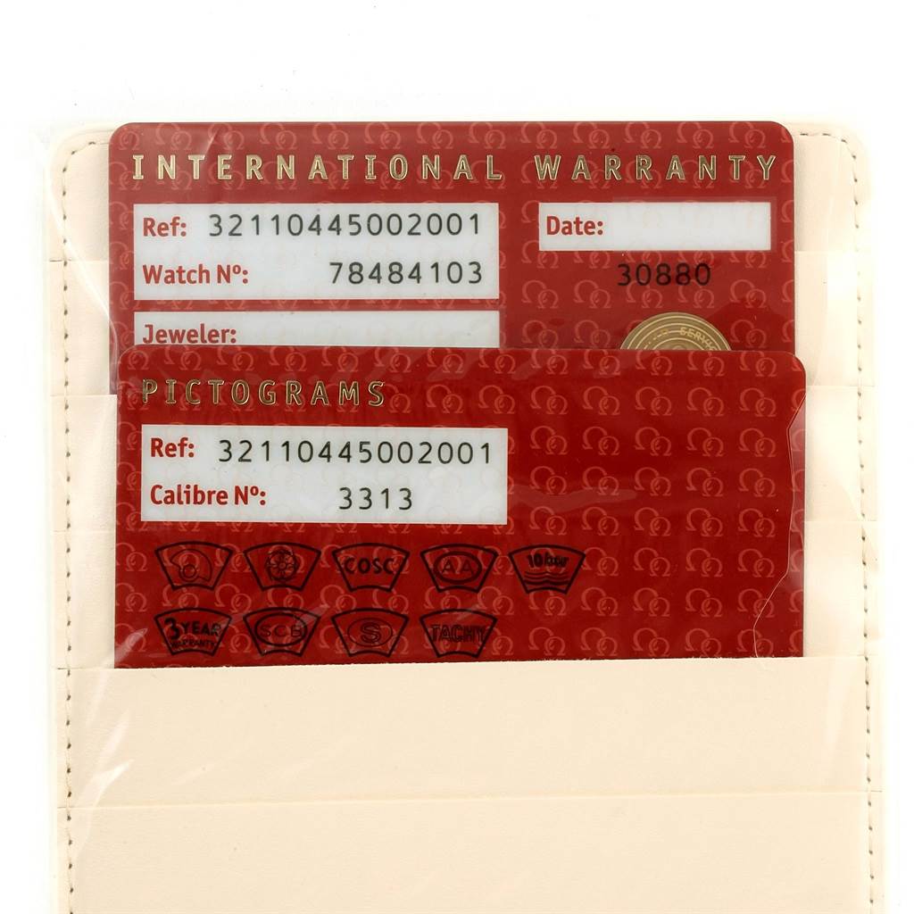 The image shows the international warranty and pictograms cards for an Omega Speedmaster 321.10.44.50.02.001 Men's Stainless Steel Silver Dial 321.10.44.50.02.001 Men's Stainless Steel Silver Dial model watch.