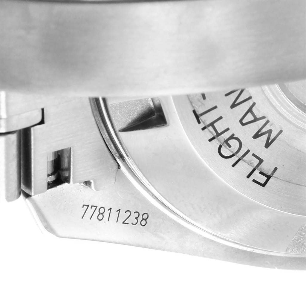 The image shows a close-up view of the case back of an Omega Speedmaster 311.30.42.30.01.005 Men
s Stainless Steel Black Dial 311.30.42.30.01.005 Men
s Stainless Steel Black Dial, highlighting engraving details and the serial number.