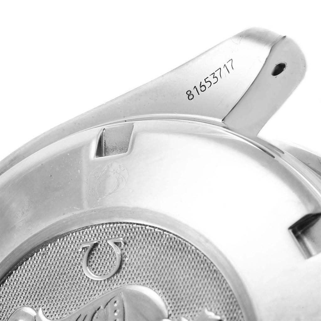 The image shows a close-up angle of the rear case and lugs of an Omega Speedmaster 3210.50.00 Men
s Stainless Steel Black Dial 3210.50.00 Men
s Stainless Steel Black Dial watch with a visible serial number.