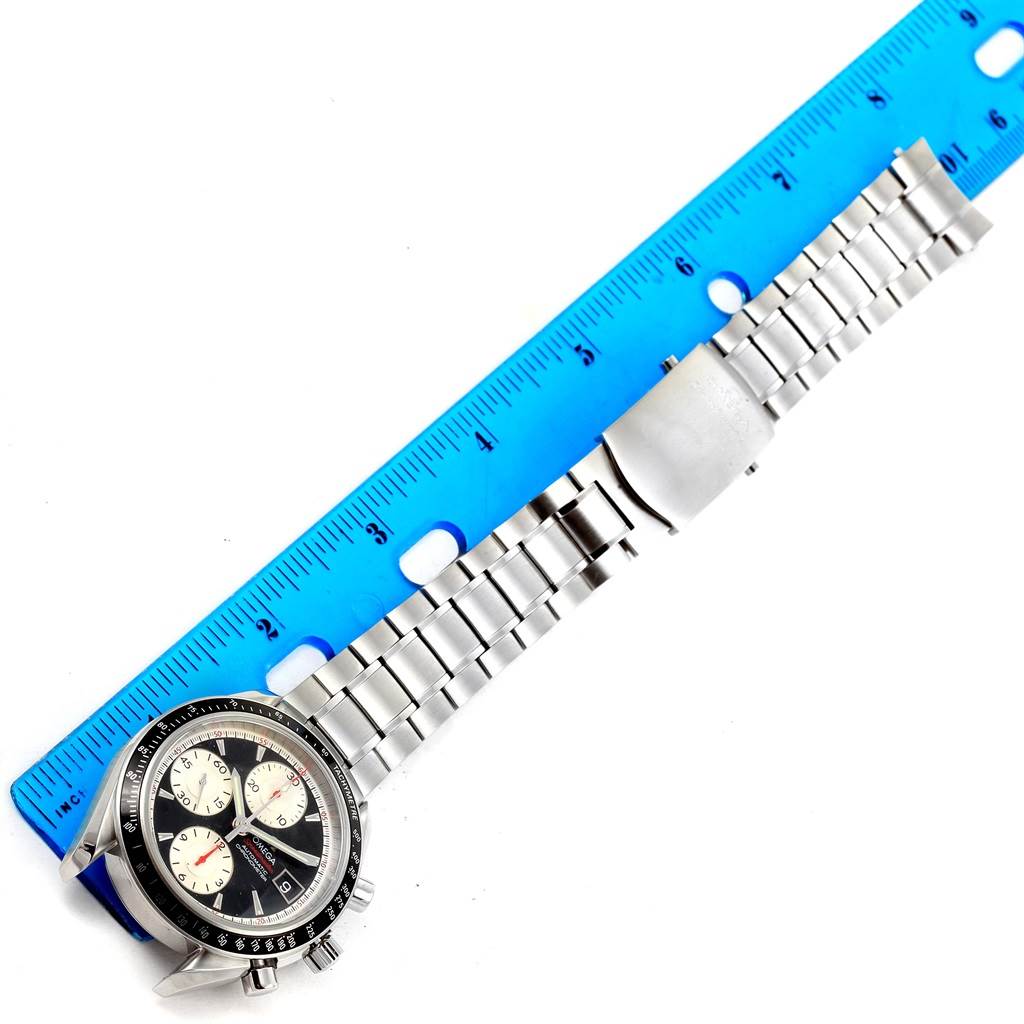 This Omega Speedmaster 3210.51.00 Men
s Stainless Steel Black Dial 3210.51.00 Men
s Stainless Steel Black Dial watch is shown from a top view, displaying its face and full metal bracelet with a ruler for scale.